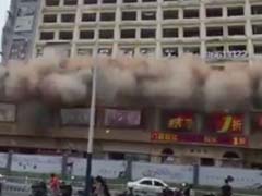 Demolished Building Comes Crashing Down As People Run For Cover In China