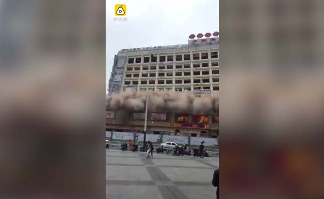 Demolished Building Comes Crashing Down As People Run For Cover In China