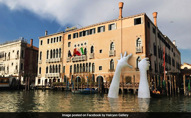 Giant Hands Emerge From The Water In Venice. Find Out Why