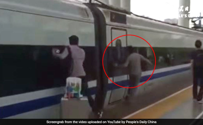 Commuter Runs Along Moving Train With Finger Stuck Between Doors