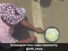Man Cooks Egg On Road In Odisha's Intense Heat Wave