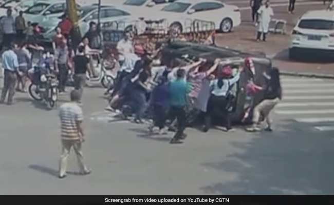 Watch: Bystanders Flip Car Upright After Accident To Save Driver