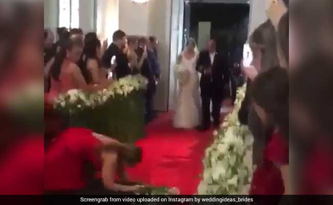 Woman Trips While Taking Bride's Photos. Acts Like Nothing Happened