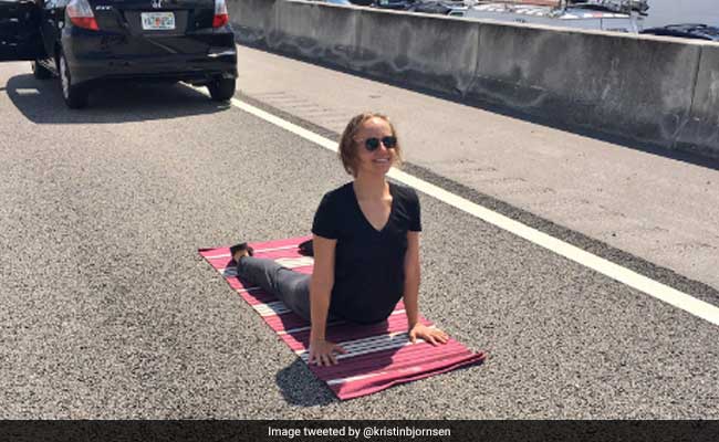 Stuck In Traffic, This Woman Decided To Do Yoga On The Highway