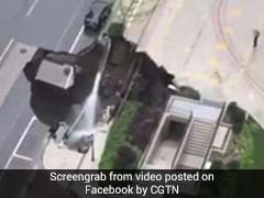 Giant Sinkhole Appears On Road, Swallows Car And Tree