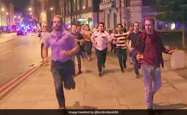 In Photo Of Pint-Clutching Man Amid London Chaos, Britain Shows Its Stiff Upper Lip