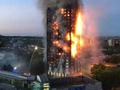 UK Firefighters Battle Blaze At Low-Rise Building In East London