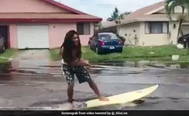 Teens Filmed 'Surfing' Flooded Streets Of Florida
