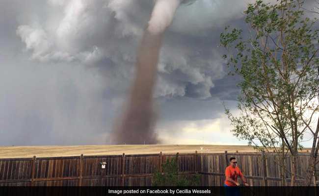 Man Calmly Mows Lawn As Tornado Swirls Behind Him. Pic Is Going Viral