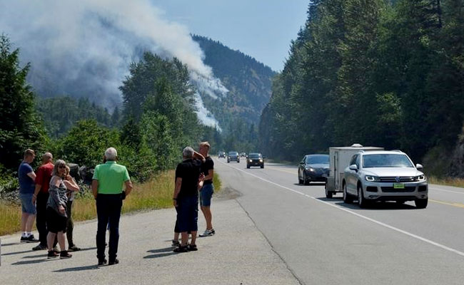 Canada Wildfires Disrupt Industry, Force 14,000 From Homes