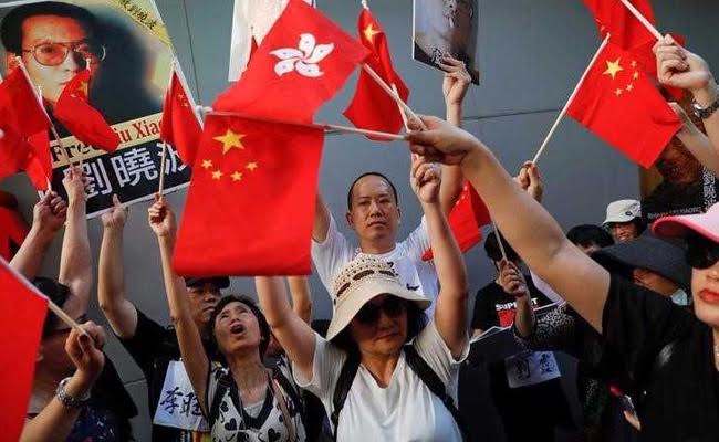 China's President Xi Jinping Talks Tough On Hong Kong As Thousands Protest For Democracy