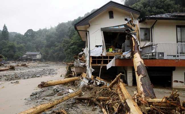 Japan Prime Minister Shinzo Abe Sees Devastation In Flood-Hit Area