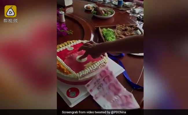 This Birthday Cake Spits Out Money And We're Totally Impressed
