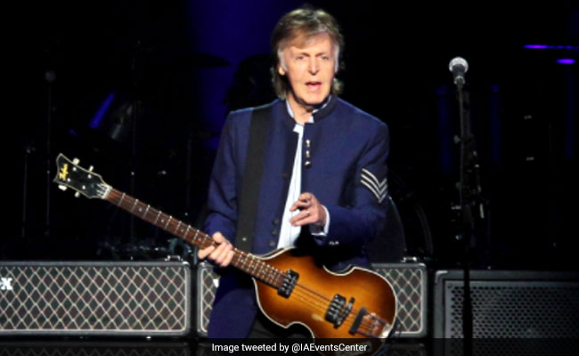 paul mccartney playing guitar