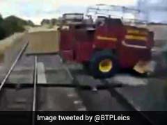 Caught On Camera: Shocking Moment Speeding Train Misses Tractor By Inches
