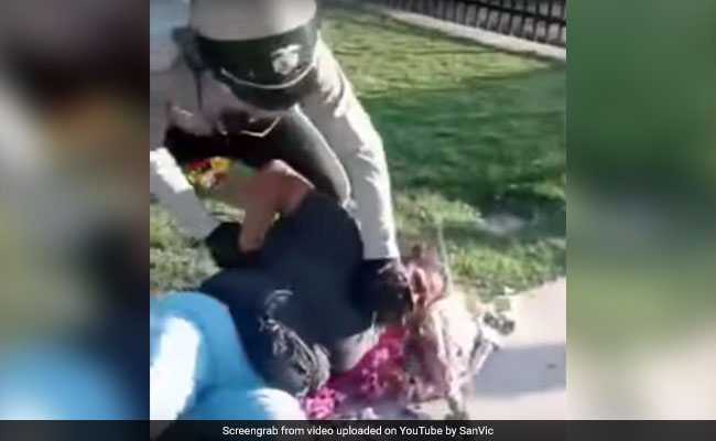 Woman Roughed Up By Police For Selling Flowers In California, Video Goes Viral