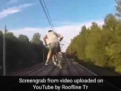 Watch: Cyclists Attempt Riding On Roof Of Moving Train