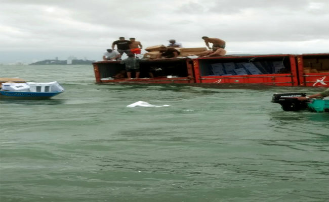 Scavengers Swoop After Containers Fall From Brazilian Ship