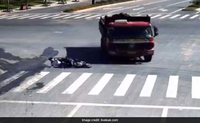Watch: Bike Skids Under Truck, Rider Walks Away Unhurt
