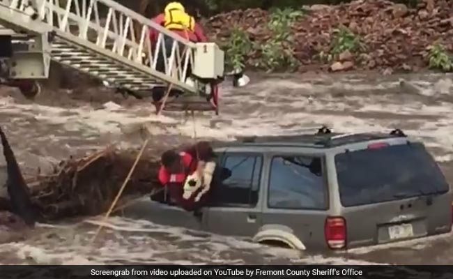 Watch: Dramatic Rescue Of Man, Dog Trapped In Car During Flash Floods