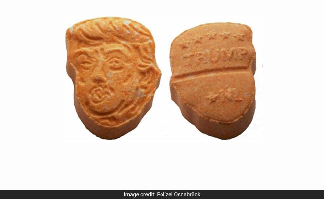 Germany's Orange Ecstasy Pills Have Trump's Name - And Face - All Over Them