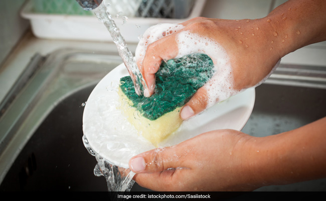 Your kitchen sponge harbors zillions of microbes. Cleaning it