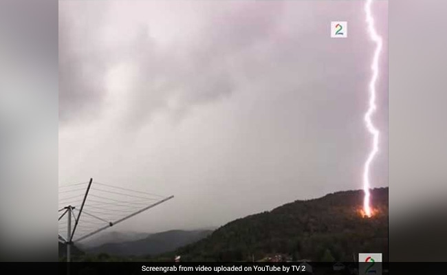 Lucky Escape For Man Filming Thunder As Lightning Strikes Meters From Him