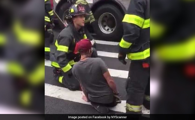 Video: Man Stuck In Tiny Sinkhole As Road Collapses, Rescued By Firemen