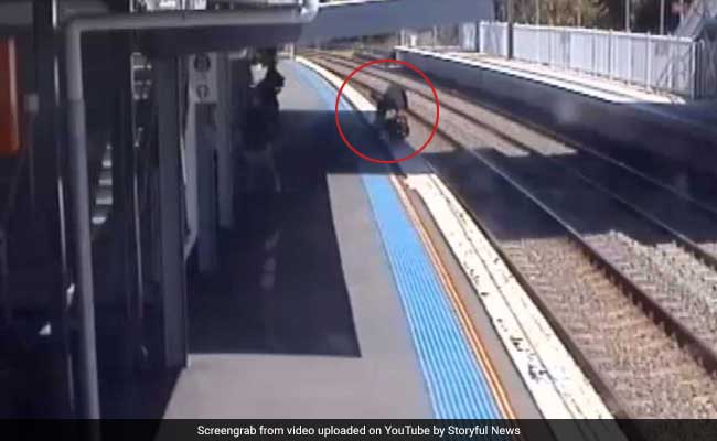 Caught On CCTV: Mum Rescues Baby From Train Tracks With Seconds To Spare