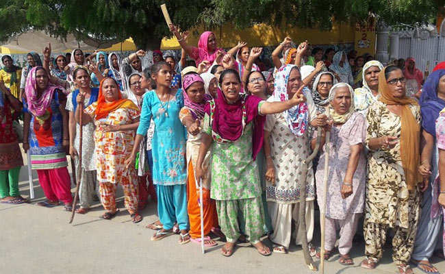 'Armed' With Sticks, Ram Rahim's Women Followers Take Turns To Guard Dera