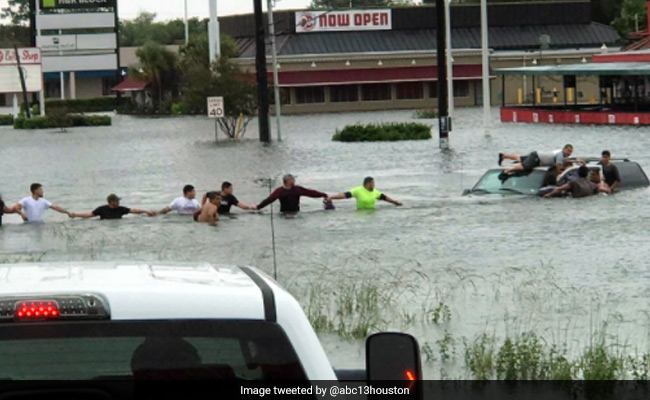 Watch: A Human Chain To Save Man Trapped In SUV