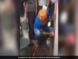 Tourism Minister Alphons Kannanthanam Cleans Tobacco Stained Walls With Bare Hands Tourism Minister Alphons Kannanthanam Cleans Tobacco Stained Walls With Bare Hands