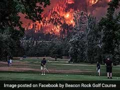 Golfers Continue Game As Wildfire Blazes Behind. Pic Is Crazy Viral