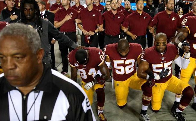 NFL stars kneel for anthem to defy Trump