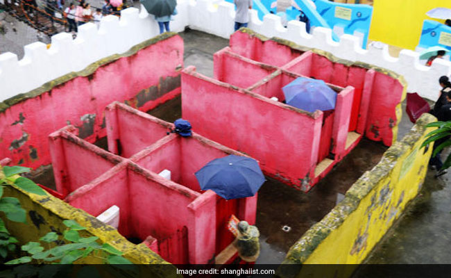 People Forced To Carry Umbrellas To Bizarre Toilets With No Ceilings