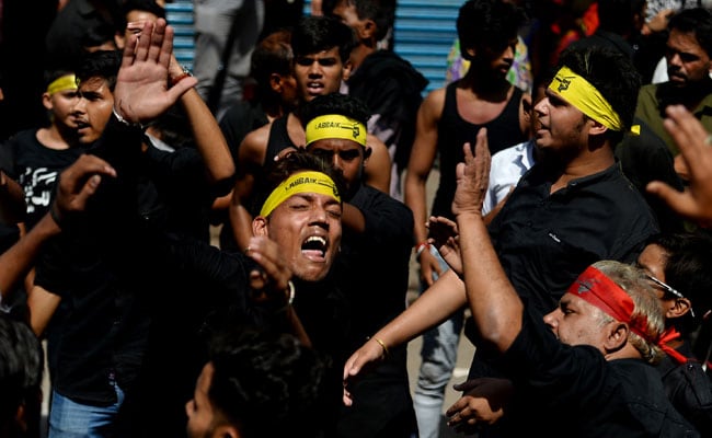 A young Muslim boy displays his stick-fighting skills during a procession  to mark Ashoura in New Delhi, India, Saturday, July, 29, 2023. Ashoura is  the tenth day of Muharram, the first month