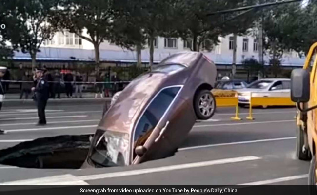 Rolls-Royce Plunges Into Sinkhole, Owner Forced To Climb Out Of Window