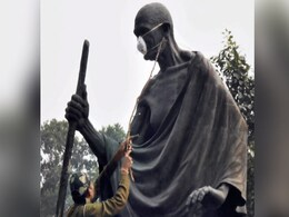 Delhi Lawmakers Tie Protective Mask On Mahatma Gandhi's Statue Delhi Lawmakers Tie Protective Mask On Mahatma Gandhi's Statue