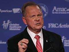 Woman Says Senate Candidate Moore Initiated Sexual Encounter When She Was 14, He Was 32