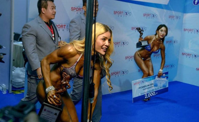 The first female bodybuilders and strongwomen showing off their