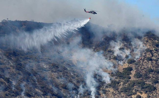 Thousands Flee As Wildfire 