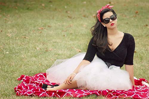 woman dressed stylishly in a park