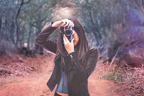 woman taking a photograph