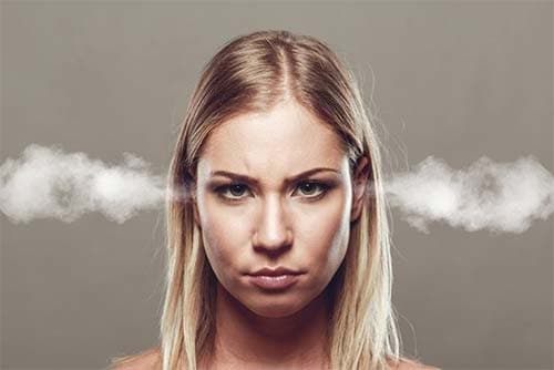 woman with smoke from her ears