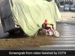 Lorry Carrying Stones Flips Over. Biker's Close Shave Caught On Film