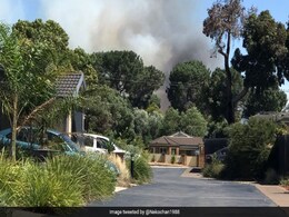 Bushfires Destroy Buildings In Australia As Heatwave Melts Highway Bushfires Destroy Buildings In Australia As Heatwave Melts Highway