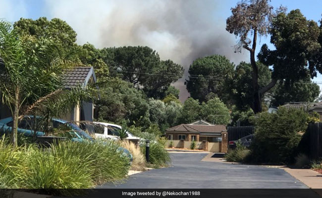 Bushfires Destroy Buildings In Australia As Heatwave Melts Highway