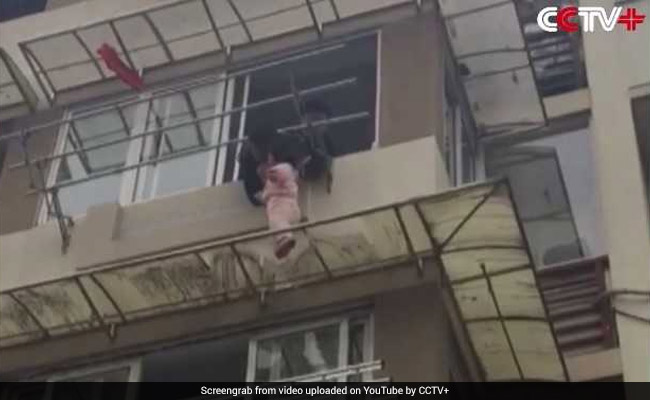 Video: Man Risks Life To Save Child Hanging From Third Floor Ledge