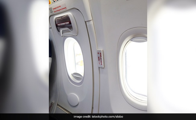 Tired Of Waiting, Passenger Uses Emergency Exit, Sits On Wing