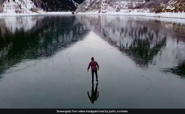 Drone Footage Of Ice Skater On Frozen Dam Is Scary But So Stunning